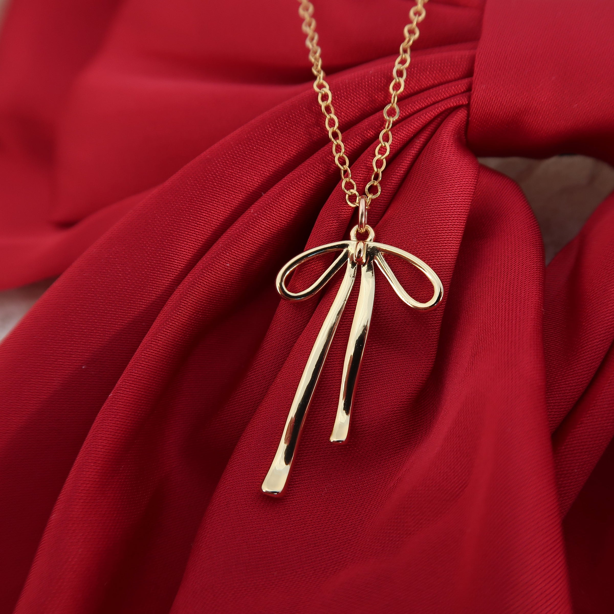 BOW NECKLACE - GOLD